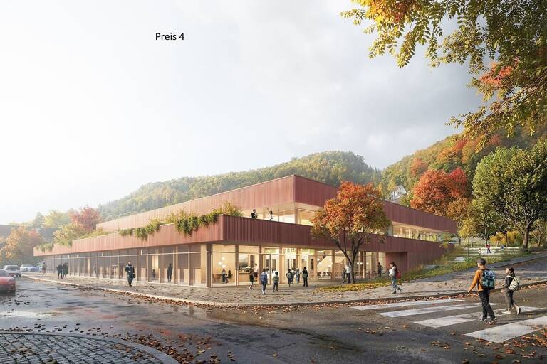 Ein modernes, zweistöckiges Gebäude mit großen Glasfenstern und begrünten Dachflächen steht in einer herbstlichen, von Hügeln und Bäumen umgebenen Landschaft, während Menschen und Autos darumherum zu sehen sind.